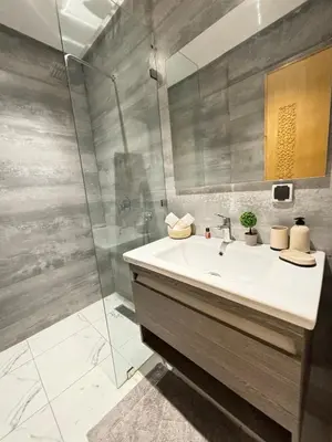 a bathroom with a sink and a shower at Le cœur de la ville ocre in Marrakech