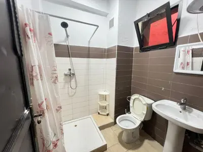 a bathroom with a toilet and a sink at Homes 365 Residence Caricia in Marrakech
