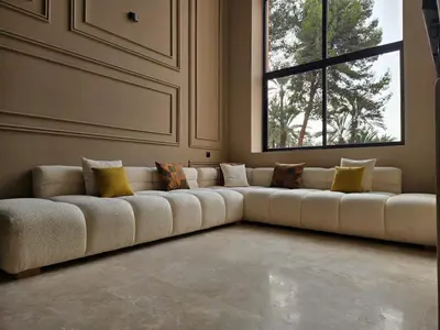 a large couch in a room with a window at Beautiful 5 bedroom duplex! Pool! in Oulad Akkou