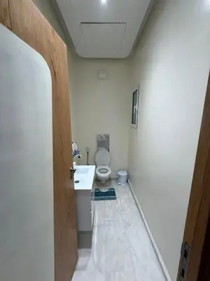 a bathroom with a toilet and a sink at Riad Garden Apartement & WiFi & Pool & Parking in Marrakech