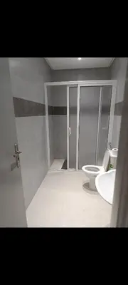 a bathroom with a toilet and a sink at Chambre Marrakech 2 in Marrakech