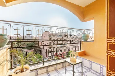 a balcony with a view of a city at Guéliz Marrakech-Authentique, spacieux , central in Marrakech