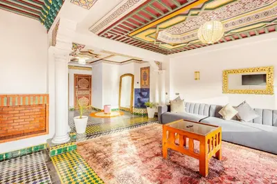a living room with a couch and a table at Guéliz Marrakech-Authentique, spacieux , central in Marrakech