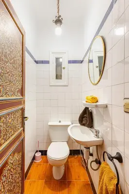 a bathroom with a toilet and a sink and a mirror at Guéliz Marrakech-Authentique, spacieux , central in Marrakech