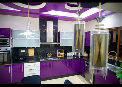 a purple kitchen with black counters and purple ceilings at Spacious Moroccan Stay, Near Airport in Marrakech