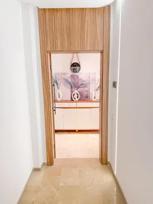 a hallway with a door to a room at Modern apartment in Gueliz Luxury residence in Marrakech