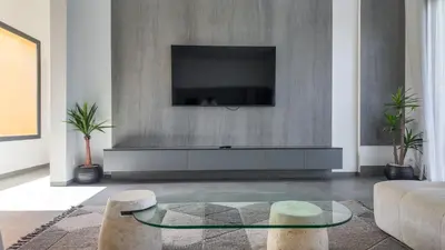 a living room with a tv and a couch at Villa SLIMANE - Villa plain-pied sans vis à vis in Marrakech