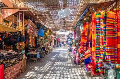 a market with a bunch of different types of shops at Appart VIP 5 étoiles et romantique à Guéliz avec Piscine, Clim, Parking et Wifi haut débit 200 Mb in Marrakech