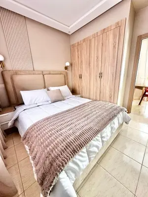 a bedroom with a large bed in a room at Homekesh in Marrakech