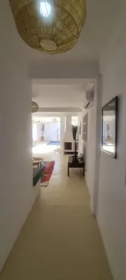 a hallway with a living room with a ceiling at Villa NAIM in Marrakech