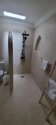 a bathroom with a shower and a toilet in a room at Villa NAIM in Marrakech