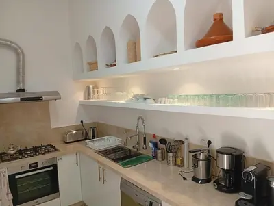 a kitchen with a sink and a counter top at Riad Nouonsa 4ch 8 pax Medina Bab Taghzout in Marrakech
