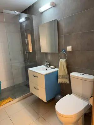 a bathroom with a shower and a toilet and a sink at Near Gueliz 2 Bedrooms 3 ACs Fast WiFi Netflix in Marrakech