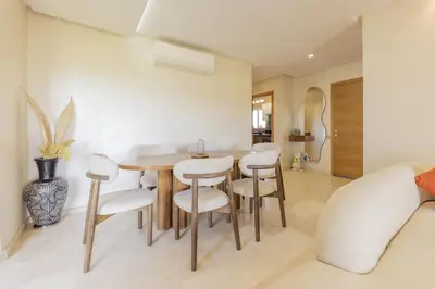 a dining room with a table and chairs at Beautiful 3 bedroom apartment for 6 people Prestigia Golf Saphir in Marrakech