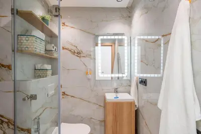 a bathroom with a sink and a shower at The Marrakech Mosaic A Fusion of Style city Central in Marrakech