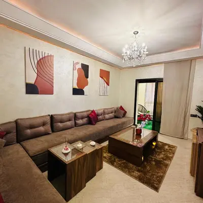 a living room with a couch and two tables at Chic stay near Gueliz - Free parking in Marrakech