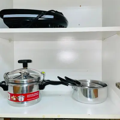 a pot and a pan on top of a stove at Chic stay near Gueliz - Free parking in Marrakech