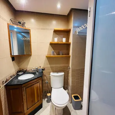 a bathroom with a toilet and a sink at Chic stay near Gueliz - Free parking in Marrakech