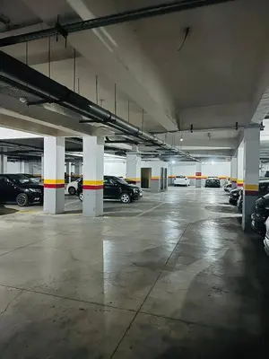 an empty parking garage with cars parked in it at Chic stay near Gueliz - Free parking in Marrakech