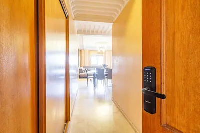 an open door to a dining room with a table at Wintering I Authentic Accommodation I Pool in Marrakech