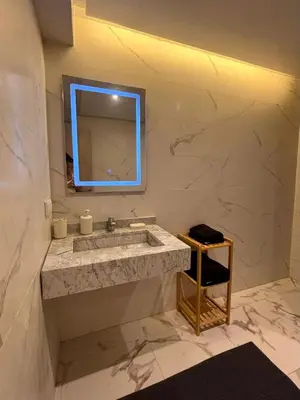 a bathroom with a sink and a mirror at Nice apartment in Marrakesh in Marrakech