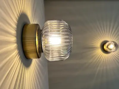 a light on a wall with two lights on it at Luxury Studios with Balcony in Marrakech
