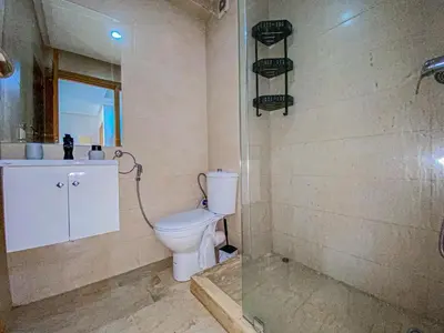 a bathroom with a toilet and a shower at Opera hivernage in Marrakech