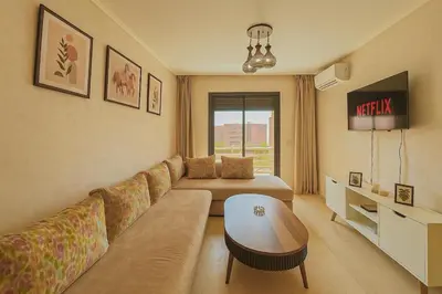 a living room with a couch and a table at Opera hivernage in Marrakech
