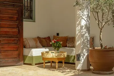 a living room with a couch and a table at Riad Dar Ben Slimane in Marrakech