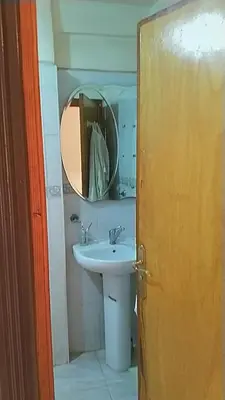 a bathroom with a sink and a mirror at Marrakech Allal El Fassi in Marrakech
