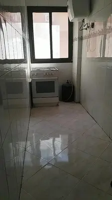 an empty kitchen with a stove and a window at Marrakech Allal El Fassi in Marrakech