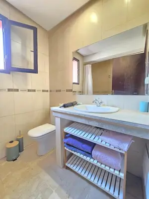 a bathroom with a sink and a toilet at Appartement confortable et propre in Marrakech