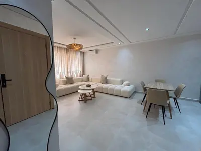 a living room with a couch and a table at Majorelle Retreat - Luxury Studio in Marrakech