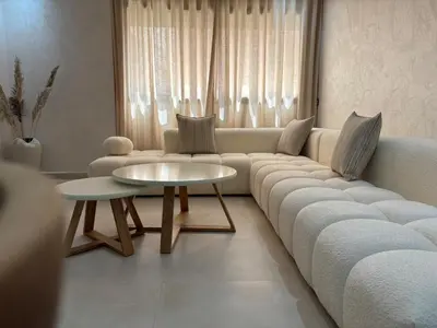 a living room with a couch and a table at Majorelle Retreat - Luxury Studio in Marrakech