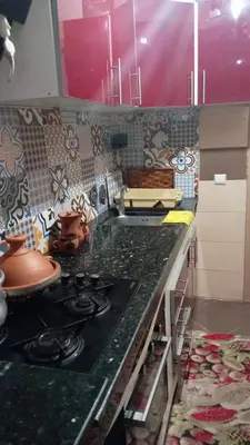 a kitchen with a counter top with a stove at Cozy Flat near Gueliz in Center in Marrakech