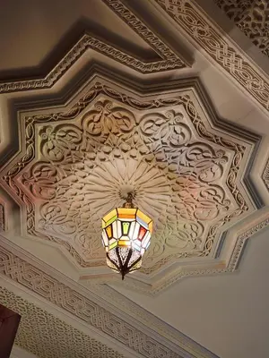 a coffered ceiling with a light hanging from it at Riad Hostel ADI in Marrakech