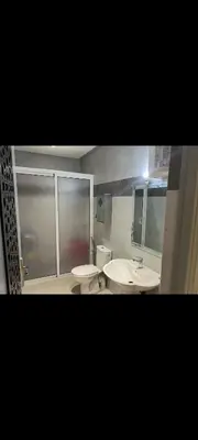 a bathroom with two sinks and a toilet at Chambre Marrakech 4 in Marrakech