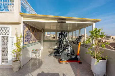 a garage with a gym on top of a building at Riad du Rabbin in Marrakech