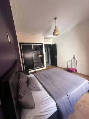 a bedroom with a large bed in a room at apartment in the center of Guéliz in Marrakech
