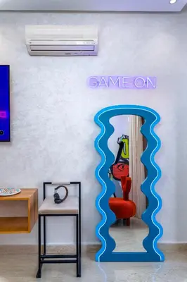 a room with a wall with a sign that says game on at -New- Appartement stylé au cœur de Marrakech in Marrakech