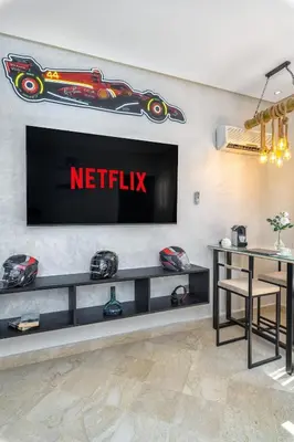 a wall with a netflix sign on a wall at Condo in Gueliz inspired by motorsports in Marrakech