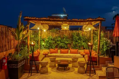 a patio with a couch and a gazebo at Riad Sahelia in Marrakech