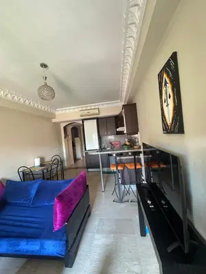 a living room with a couch and a table at Apartement in the centre in Marrakech