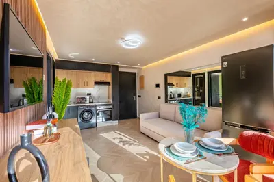 a living room with a couch and a table at AYLAL Marrakech in Marrakech