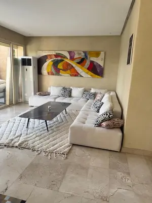 a living room with a couch and a coffee table at Villa argan in Marrakech