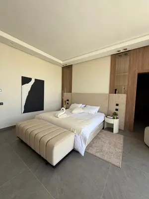 a large bedroom with a large bed in it at Villa ALIYAH in Marrakech