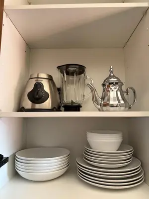 a shelf with plates and a blender on it at Elegant & Cozy Stay in Center in Marrakech