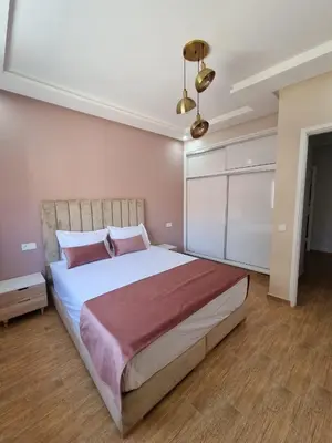 a bedroom with a large bed in a room at Modern Fully equipped 2 rooms apartment in Marrakech