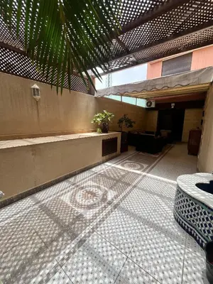 a room with a tiled floor in a building at GUELIZ 2 chambres 1 terrasse proche majorelle in Marrakech