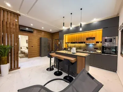 a kitchen with a island with a counter top at Séjour chic en ville Jacuzzi privé et Wi-Fi gratuit in Marrakech